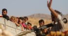 Mass grave uncovered at former ISIS stronghold may hold up to 400 dead