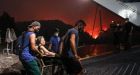 Thousands flee as flames from wildfires reach Athens suburbs