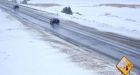 Freezing rain closes schools and highways, leaves thousands without power